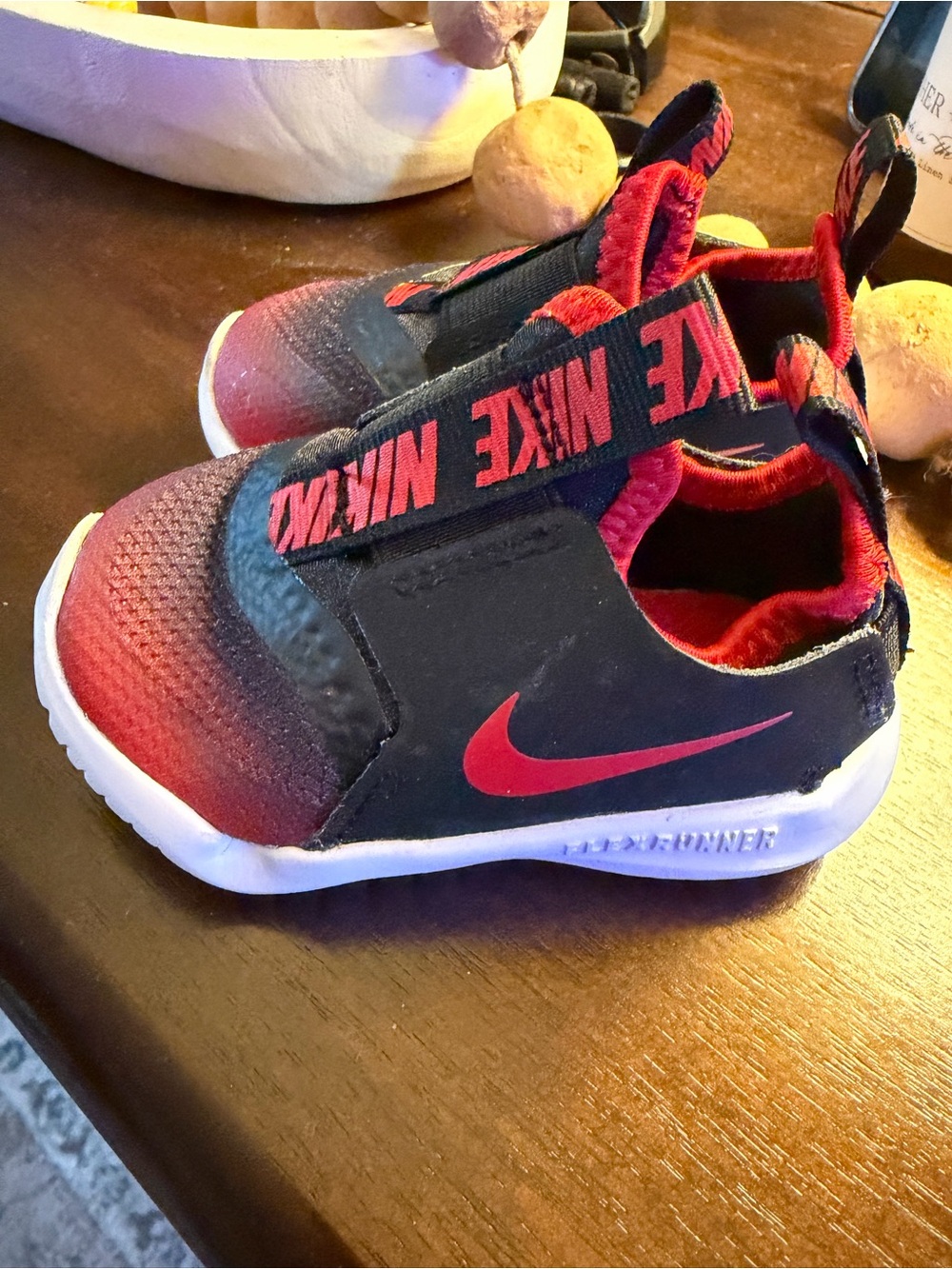 Nike Kids Black and Red Slip-On Athletic Sneakers